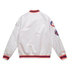 Celebrate your New York Mets pride with this Mitchell & Ness City Collection Satin Full-Snap Varsity Jacket. This stylish jacket features embroidered Mets graphics and a quilted lining for added warmth. The elastic cuffs, collar, and hem with sublimated stripes provide a comfortable fit, while the two front pockets and one interior pocket offer ample storage space. This jacket is perfect for any Mets fan, whether you're at Citi Field or watching the game at home. Brand: Mitchell & Ness; Elastic White Varsity Jacket With Button Closure, Casual White Windbreaker For College, Casual White College Windbreaker, White Cotton Varsity Jacket With Button Closure, Retro White Outerwear With Ribbed Cuffs, White Outerwear With Button Closure For College, Collegiate White Outerwear With Ribbed Cuffs, White Baseball Collar Outerwear For Sports Events, White Collegiate Outerwear With Ribbed Cuffs