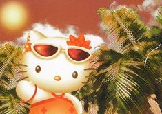 the hello kitty is wearing sunglasses and standing in front of palm trees