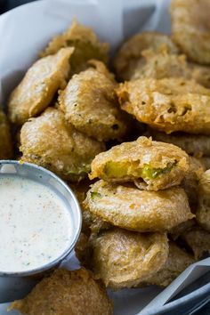 fried food with dipping sauce in a basket