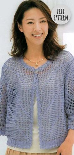 a woman wearing a blue knitted cardigan with the words free pattern on it