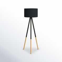 a black lamp with wooden legs on a white background