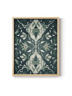 a green and white wall hanging on the side of a wooden framed art print with an ornate