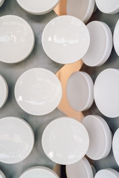 many white plates stacked on top of each other