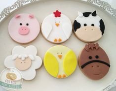 decorated cookies in the shape of farm animals