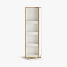 a tall white and gold bookcase with three shelves on each side, against a white background