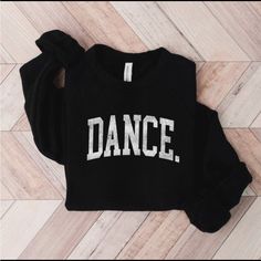 Black Bella Canvas Crew Neck With White Dance Graphic Print. Stretch Black Top For Dance Class, Black Stretch Top For Dance Class, Black Tops With Letter Print For Dance Class, Black Letter Print Dance Top, Fitted Black Top For Dance Class, Stretch Black Tops For Dance, Black Stretch Tops For Dance, Casual Tops For Dance In Fall, Casual Tops For Fall Dance