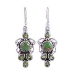 Green springs forth in these dangle earrings from Neeru Goel held by sterling silver framework. Four carats of peridot join composite green turquoise shot through with luxurious golden veins. Every element of the pair shines and sparkles with verdant color lush and brilliant. Green Sterling Silver Dangle Earrings, Green 925 Sterling Silver Earrings, Sterling Silver Earrings With Green Color Stamped 925, Green Sterling Silver Earrings Stamped 925, Green Stone Earrings, Rough Gemstone Ring, Raw Opal Ring, Engagement Earrings, Engagement Ring For Her