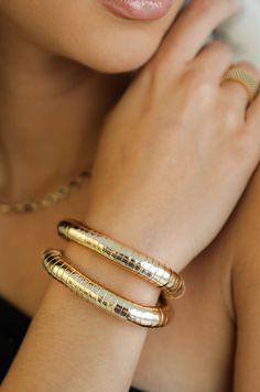 Our Liquid Gold Bracelet Set was made to be styled as your bracelet stacking foundation. Their sleek, sophisticated shape allows them to play nicely with your other gold. With a golden, iridescent shine that sun rays will follow, you will liquify your wrist. And as a set, receive two times the shine with two times the bracelet. - Pair of two: starts layering for you - Immersed in 18k gold - Freshwater pearls - Stretch: Offers a comfortable and versatile fit Gold Stretch Bracelet, Bachelorette Party Dress, Bracelet Set Silver, Gold Bracelet Set, Back Necklace, Liquid Gold, Chain Anklet, Gold Plated Bracelets, Gold Plated Chains