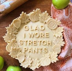 a cookie with the words glad i wore stretch pants written in frosting on it