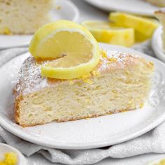 a slice of lemon cake on a white plate