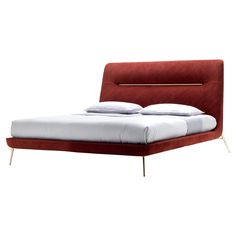 a red bed with white sheets and pillows