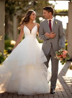 a bride and groom are walking together