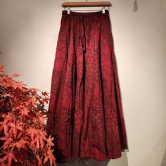 FEATURE: Handmade Ethically, Breathable, Great for Ladies, Comfortable to Wear & Stylish. MATERIAL: 100% Cotton SIZE: One size fits most, drawstring at waist GENDER: F This beautiful long skirt is very comfortable to wear. It is easy to wear and great for many occasions. One size fits most, ideal for leisure and are great for many different activities like travelling, dancing, going to festivals and other.  It also has ties in the inside, which you can tie them up to make layering.  WASHING INST Cotton Long Skirt With Drawstring, Bohemian Skirt With Drawstring, Bohemian Drawstring Skirt, Red Flowy Hippie Maxi Skirt, Bohemian Red Cotton Skirt, Red Long Hippie Skirt, Luxury Red Bohemian Skirt, Non-stretch Red Bohemian Skirt, Red Skirt