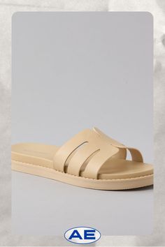 Vegan leather upper/Open toe/Rubber outsole Beige Leather Sandals With Textured Sole, Beige Synthetic Sandals With Single Toe Strap, Beige Synthetic Sandals With Rubber Sole, Beige Leather Flat Sandals, Beige Flat Leather Sandals, Modern Beige Sandals With Textured Footbed, Beige Flat Sandals With Leather Footbed, Modern Beige Sandals With Leather Footbed, Leather Footbed Sandals In Beige For Spring