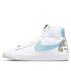 The Nike Blazer Mid '77 is a classic silhouette with a sustainable construction. The shoe's white canvas upper incorporates 20% recycled content by weight, overlaid by tonal synthetic suede and accented by blue on the Swoosh and heel patch, achieved through plant dye. The right heel patch includes a scientific infographic, while the heels of both shoes include an indigo plant graphic. The tongue tag and heel strip are built with recycled cork, with more cork worked into the herringbone rubber ou Nike Blazer Mid 77 White, School Traditions, Plant Graphic, Sustainable Construction, Bday Wishlist, Indigo Plant, Nike Blazer Mid 77, Nike Blazer Mid, Nike Blazers Mid