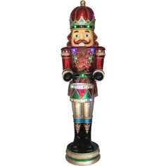 a colorful nutcracker statue is shown on a white background