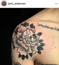 a woman's shoulder with a skull and flowers tattoo on her left arm, which reads whatever one