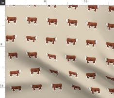 a brown and white cow pattern on a tan background