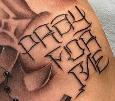 a man's arm with the words happy birthday written in cursive writing