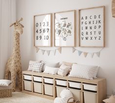 a child's room decorated in neutral tones with toys and posters on the wall