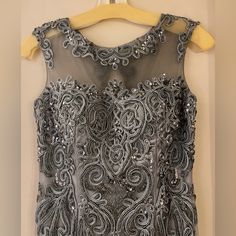 Feriani Couture Size 4 Excellent Condition Silver Sleeveless Evening Dress For Banquet, Silver Sleeveless Dress For Banquet, Sleeveless Silver Evening Dress For Banquet, Elegant Silver Evening Dress With Fitted Bodice, Silver Fitted Evening Dress For Banquet, Silver Embellished Sleeveless Evening Dress, Silver Sleeveless Evening Dress With Sweep Train, Silver Evening Dress With Sweep Train, Elegant Silver Sleeveless Evening Dress