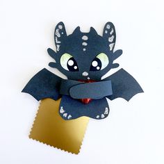 a paper cut out of a bat with eyes