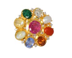 This stunning 14K gold Navratna ring is our effort to bring a new facet of modernism to traditional Indian designs. This ring contains a center flower beholding all nine precious natural gemstones which include Ruby, Yellow Sapphire, Rose Cut Diamond, Emerald, Pearl, Coral, Blue Sapphire, Hessonite Garnet (Gomed) and Cats Eye surrounded by full cut diamond setting at the borders. The centre ruby is a natural Burmese ruby weighing 2.18ct which is surrounded by other natural precious gemstones accompanied with natural diamond solitaire of 0.70ct. All gemstones are kept open at back which can be seen to admire the beauty of each gemstone and perfect for the wearer as according to Hindu mythology it is considered very auspicious to wear Navratna. Navratan Ring, Navratna Ring, Indian Designs, Burmese Ruby, Hindu Mythology, Hessonite Garnet, Cats Eye, Diamond Settings, Coral Blue