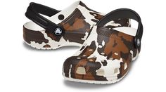 This version of the iconic clog features a fashionable cow print, helping you show off some fun, Western style. The stylish print is great for young fashionistas and farm lovers alike, and Croslite™ foam construction keeps them light and easy to wear. Grounded in comfort, spiked with personality.  Kids’ Classic Cow Print Clog Details:    Stylish cow print  Incredibly light and fun to wear  Ventilation ports add breathability and help shed water and debris  Easy to clean and quick to dry  Pivoting heel straps for a more secure fit  Customizable with Jibbitz™ charms  Iconic Crocs Comfort™: Lightweight. Flexible. 360-degree comfort. Teacher Discounts, Military Discounts, Cow Print, Western Style, Strap Heels, 360 Degree, Western Fashion, Clogs, Cow