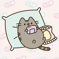 a cartoon cat laying on top of a pillow