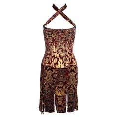 ▪ Roberto Cavalli silk corset and skirt set ▪ Red and gold brocade-print ▪ Corset top with boning and halter-neck straps which criss-cross at the front ▪ Mini skirt with multiple slits and cheetah print underlay ▪ Size: Small ▪ Fall-Winter 2004 ▪ 93% Silk, 7% Lycra ▪ Made in Italy Fitted Silk Corset With Boning, Brocade Print, Cavalli Dresses, Roberto Dress, Silk Corset, Corset And Skirt, Roberto Cavalli Dress, Silk Evening Dress, Gold Evening Dresses