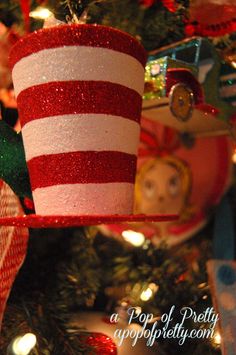 an ornament is hanging on the christmas tree with dr seuss and cat in the hat