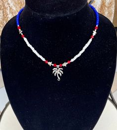 5% of proceeds go to savethemanatee.org  ... A beautiful, fun palm tree pendant set with rhinestone coconuts. The necklace includes red, white, and blue glass beads and silver star accent beads. A beautiful addition to any outfit to showcase your patriotism! Necklace length: 15.5, 16.5, or 17.5 inches Pendant height 1 inch Pendant width: .5 inch Palm Tree Pendant, Tree Pendant, Silver Stars, Pendant Set, Necklace Length, Red White And Blue, Palm Tree, Blue Glass, Palm Trees