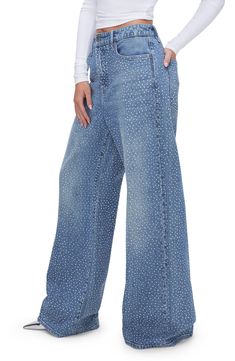 Glistening crystal embellishments dance in the light on these low-stretch wide-leg jeans featuring a faded indigo wash. 33" inseam; 25" leg opening; 13" front rise; 15 1/2" back rise (size 8) Zip fly with button closure Five-pocket style 79% cotton, 20% recycled cotton, 1% elastane Machine wash, tumble dry Imported Black Owned/Founded Mid-rise Denim Flare Jeans With Rhinestones, Rhinestone Denim Flare Jeans Straight Leg, Bedazzled Denim Bottoms, Wide Leg Bottoms With Rhinestones For Spring, Wide-leg Rhinestone Bottoms For Spring, Spring Wide-leg Bottoms With Rhinestones, Denim Blue Embellished Bottoms, Crystal Embellished Denim Jeans, Medium Wash Embellished Straight Leg Bottoms