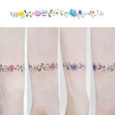 four different images of the same person's legs with flowers on them and one is showing