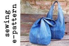 a denim purse sitting on top of a wooden bench next to a brick wall with words written below it