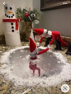 an elf is in the sink with snow