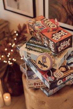 a stack of cereal boxes sitting on top of a table next to a christmas tree