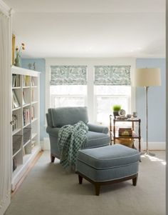 a living room filled with furniture and a book shelf