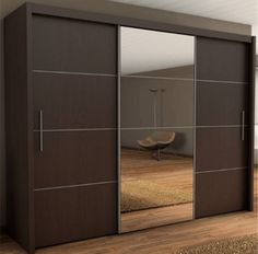 an image of a bedroom setting with mirrored closet doors