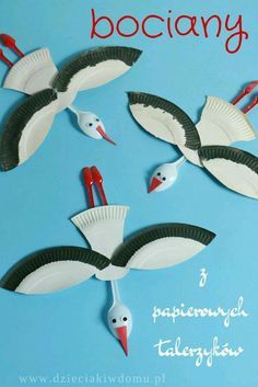 paper plate storks are flying in the sky