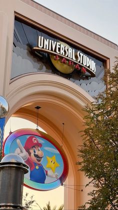 the entrance to universal studios is decorated with mario and luigi's world emblems