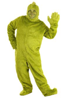 a man in a green costume is waving