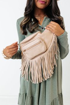 - This casual bag has boho flair! - Sleek lightweight material with long fringe detailing - Two zip closure front pockets - An adjustable shoulder strap - A spacious fully lined interior with a zip closure and additional inside zip closure pocket Spring Travel Bags With Fringe, Trendy Beige Shoulder Bag With Fringe, Beige Fringe Shoulder Bag For Travel, Beige Fringed Hobo Bag For Daily Use, Beige Fringe Hobo Bag For Daily Use, Spring Beige Shoulder Bag With Fringe, Beige Fringe Shoulder Bag For Spring, Spring Beige Fringe Shoulder Bag, Chic Travel Hobo Bag With Fringe