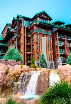 a large building with a waterfall in front of it