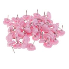 pink plastic push pins on white background