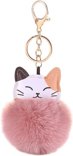 a cat keychain with a pink fur ball hanging from it's side