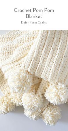 crochet pom pom blanket with text that reads, daisy farm crafts