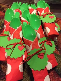 green plastic utensils wrapped in red and white paper