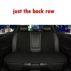 the back row of a car with black seats and red lettering that says, just the back row