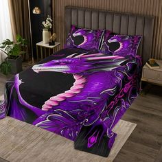 a bed with purple and black designs on it